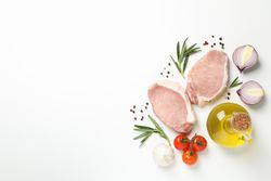 Composition with raw meat and ingredients on light background, top view