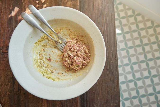 Bowl with mixed ingredients for steak tartare