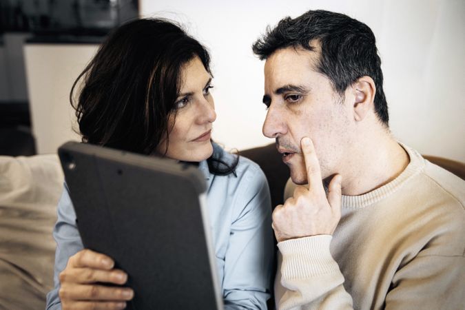 Couple in Virtual Medical Consultation for Health Monitoring, Featuring Eye Examination at Home
