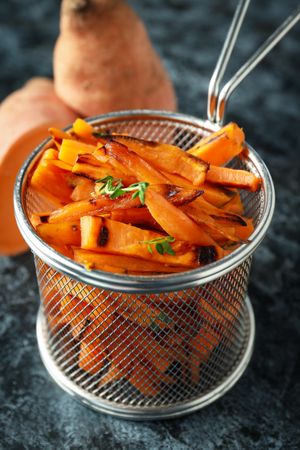 Concept of tasty food, fried sweet potato, close up