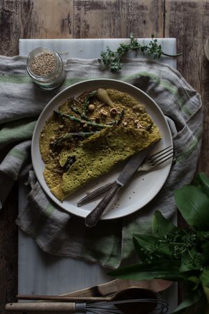 Served vegetarian crepe with oats and asparagus