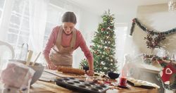 Portrait of Female Preparing Dough for Making Gingerbread for Christmas at Home.