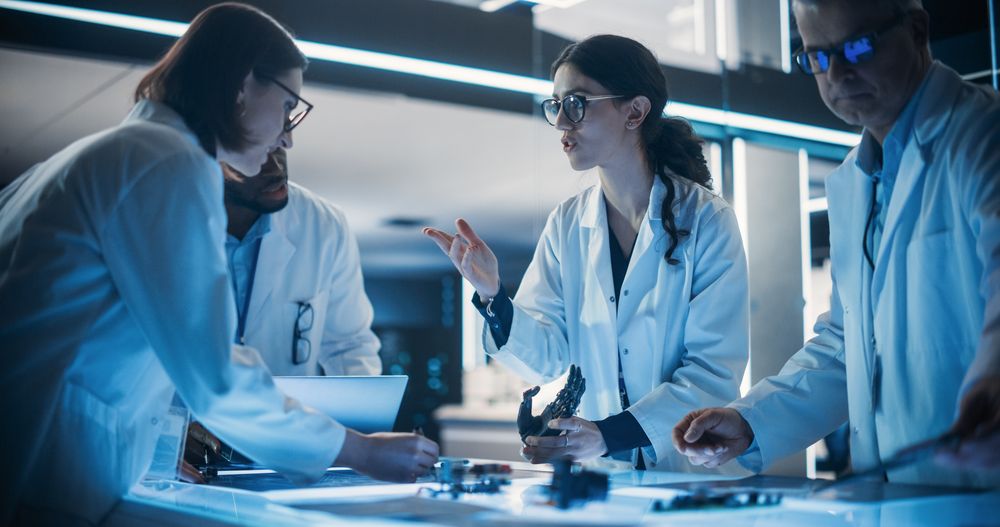 Portrait of a Group of Industrial Robotics Engineers Working on Humanoid Robot, Consulting with Specialists and Analyzing Electronic Components.