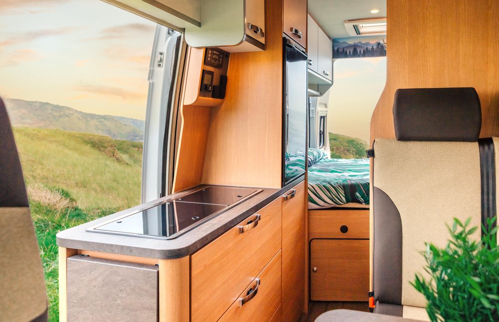 Inside of motorhome camper with door open to scenic view