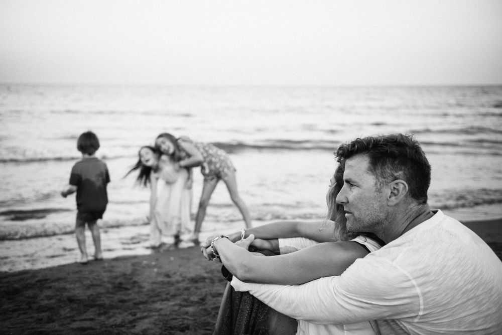 Beautiful happy family with children on beach