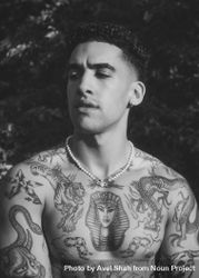 B&W portrait of tattooed shirtless male with eyes closed 0PlPl0