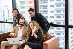 Group of smiling business people in video call together