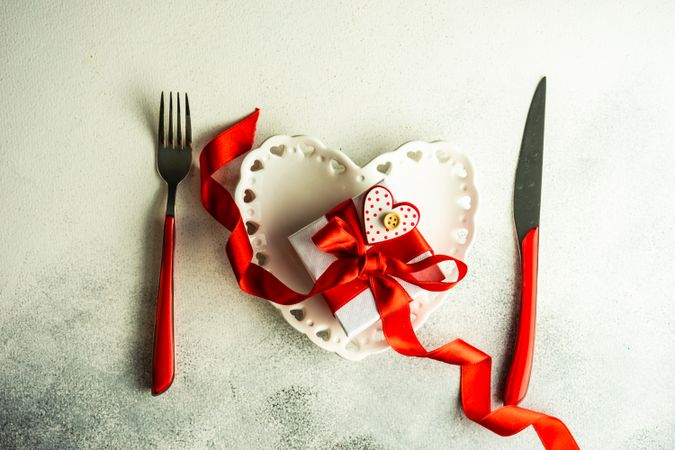 Valentine's Day red themed dinner setting with heart shaped plate