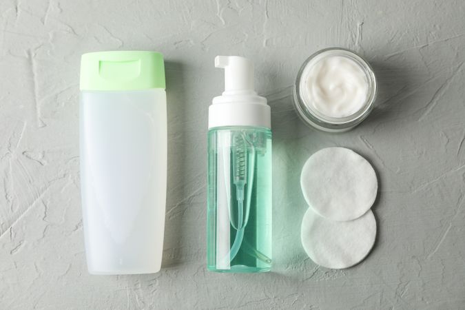 Flat lay with body care accessories on grey background, space for text