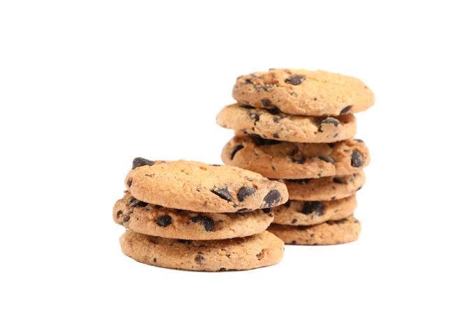 Tasty chocolate chip cookies on blank background
