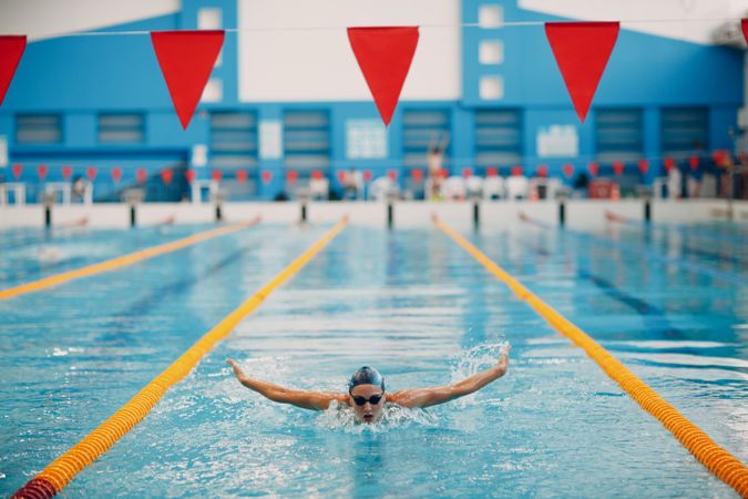 Woman swimming in race pool