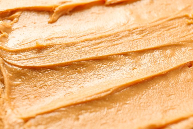 Peanut butter as background, space for text and closeup
