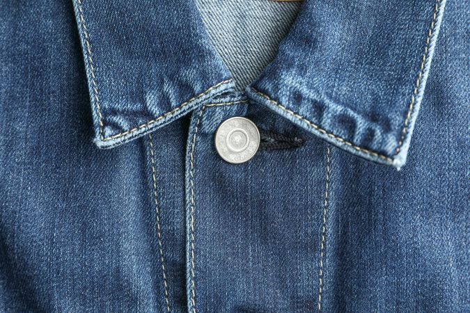 Denim jacket collar as background, place for text