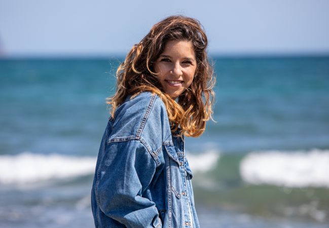 Young woman walking on seashore