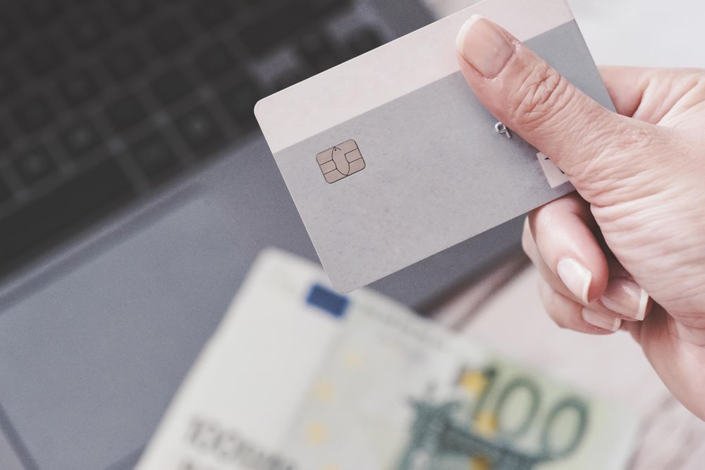 Person holding credit card