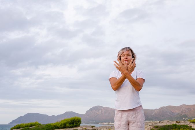 Adult woman doing breathing exercise