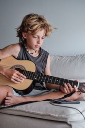 Child playing the guitar