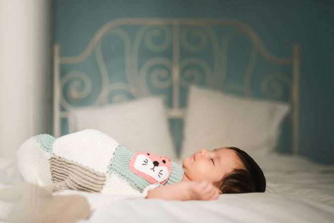 Cute baby sleeping on bed