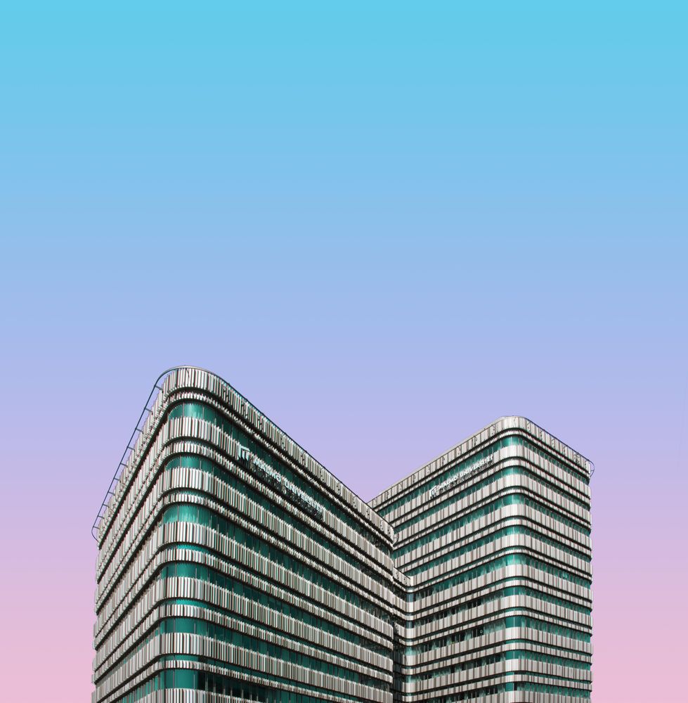 Building with green details against gradient sky