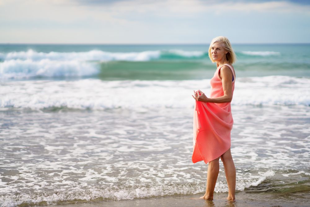 Mature woman looking out to beautiful ocean