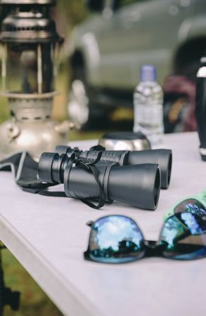 Close up of binoculars on camping table