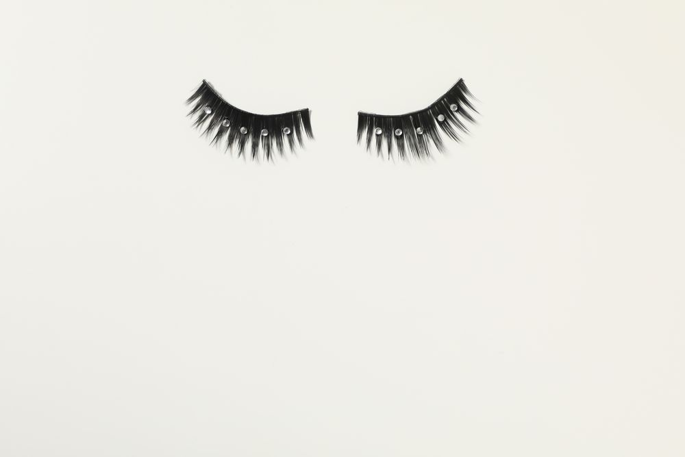 concept of cosmetology tools and beauty treatment, false eyelashes