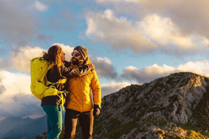 man and woman hiking in the mountains