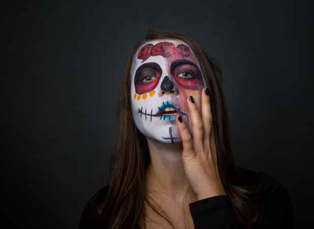 Young woman with creepy face paint