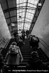 Back of people walking up stairs in station 4B1gX5