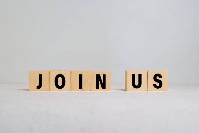 join us words on wooden blocks isolated on light background. concept of business hiring employee