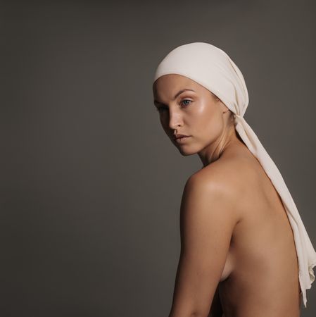 Elegant female model posing with head scarf