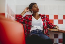 Gorgeous stylish Black woman in cafe