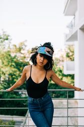 Black female by metal railing