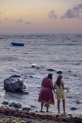 Buckshot of two woman looking out a the Indian Ocean