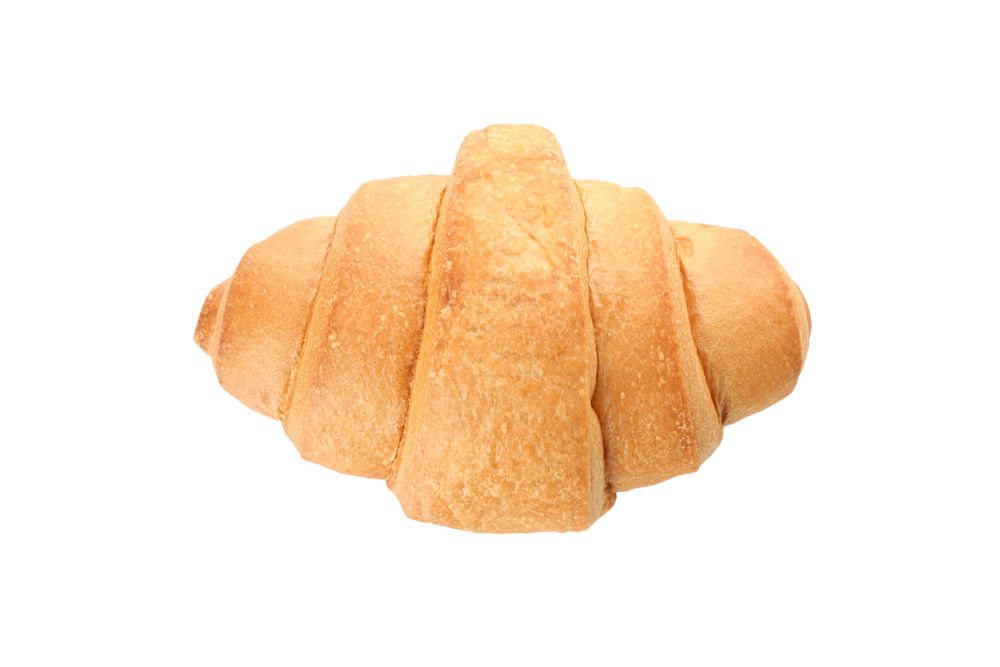 Looking down at freshly baked croissant on blank background