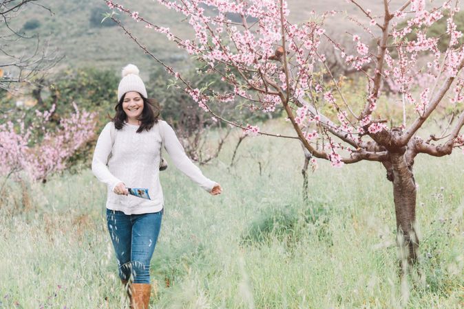 Tourist walking in spring countryside