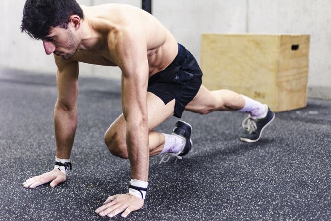 Man stretching in gym