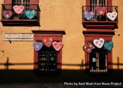 Painted heart decorating window balconies in Oaxaca with fence 4mayQ4