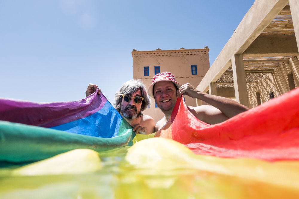 Happy gay couple in swimming pool