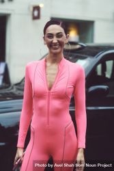 London, England, United Kingdom - September 18 2021: Smiling woman in pink jumpsuit bDDjpb