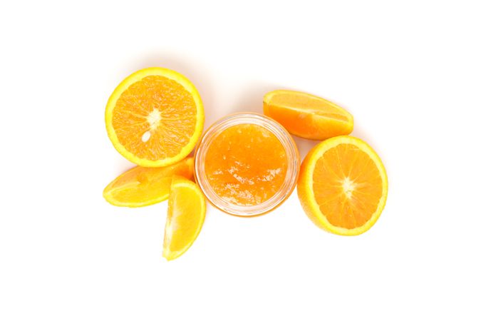 Delicious orange jam isolated on plain background