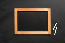 Wooden framed writing board surrounded with chalk