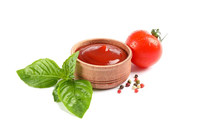 Fresh cherry tomato with basil, sauce and spices isolated on blank background. Ripe vegetables
