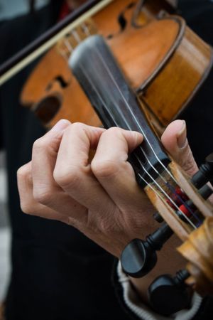Close-up shot of person playing violin