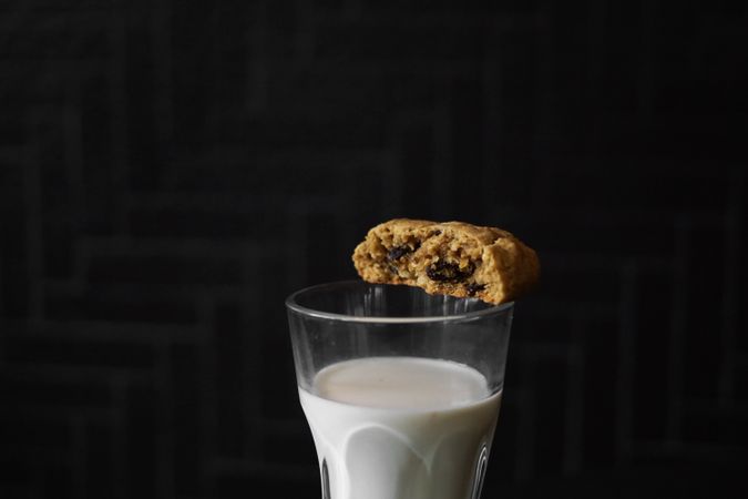 A glass of milk and cookies close up