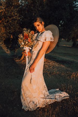 Woman in dress with flower bouquet
