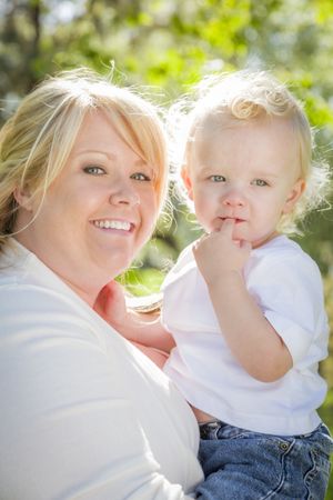 Young Mother Holding Her Adorable Baby Boy