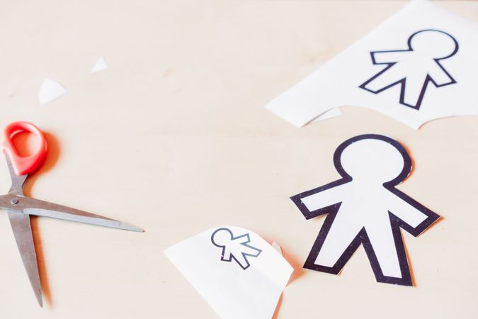 Funny paper toys near scissors