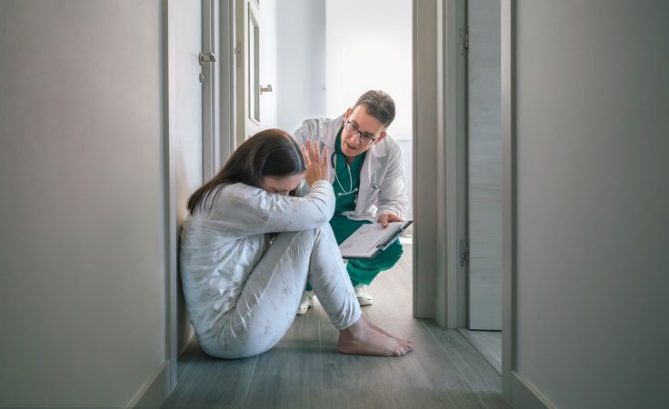 Doctor trying to help woman who refuses help