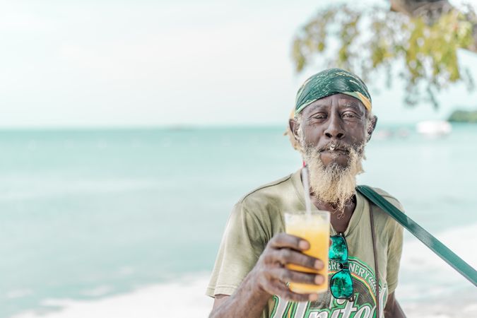 Jamaican man playing guitar